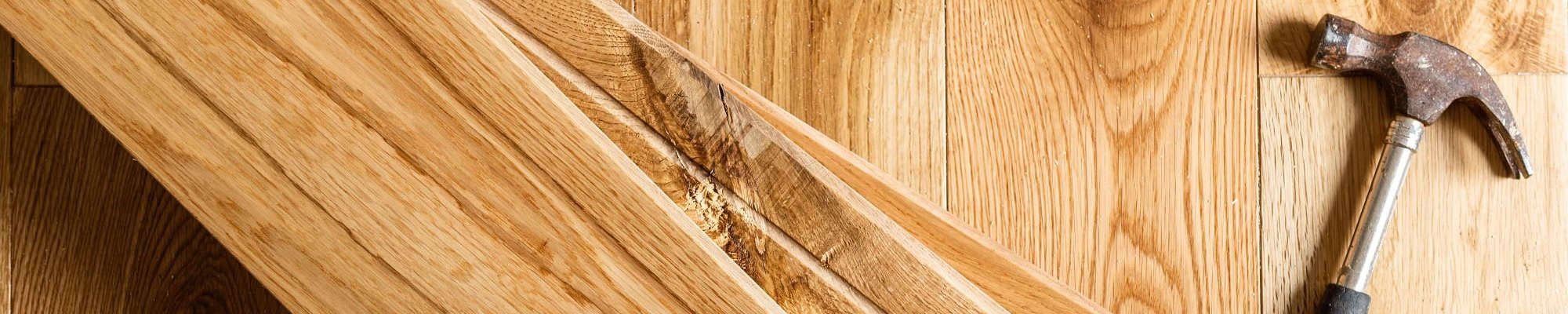 hammer on hardwood floor - flooring services in Auburn, IN