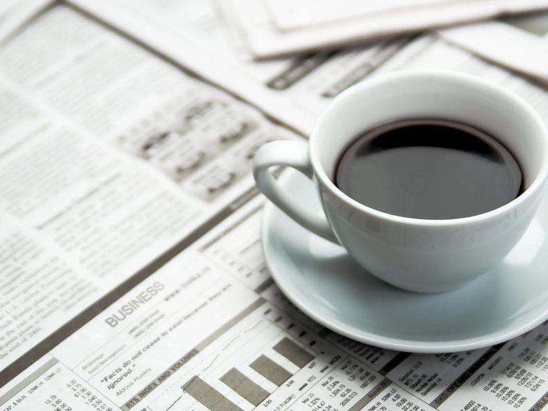 coffee mug on newspaper - Shop at Home in Auburn, IN